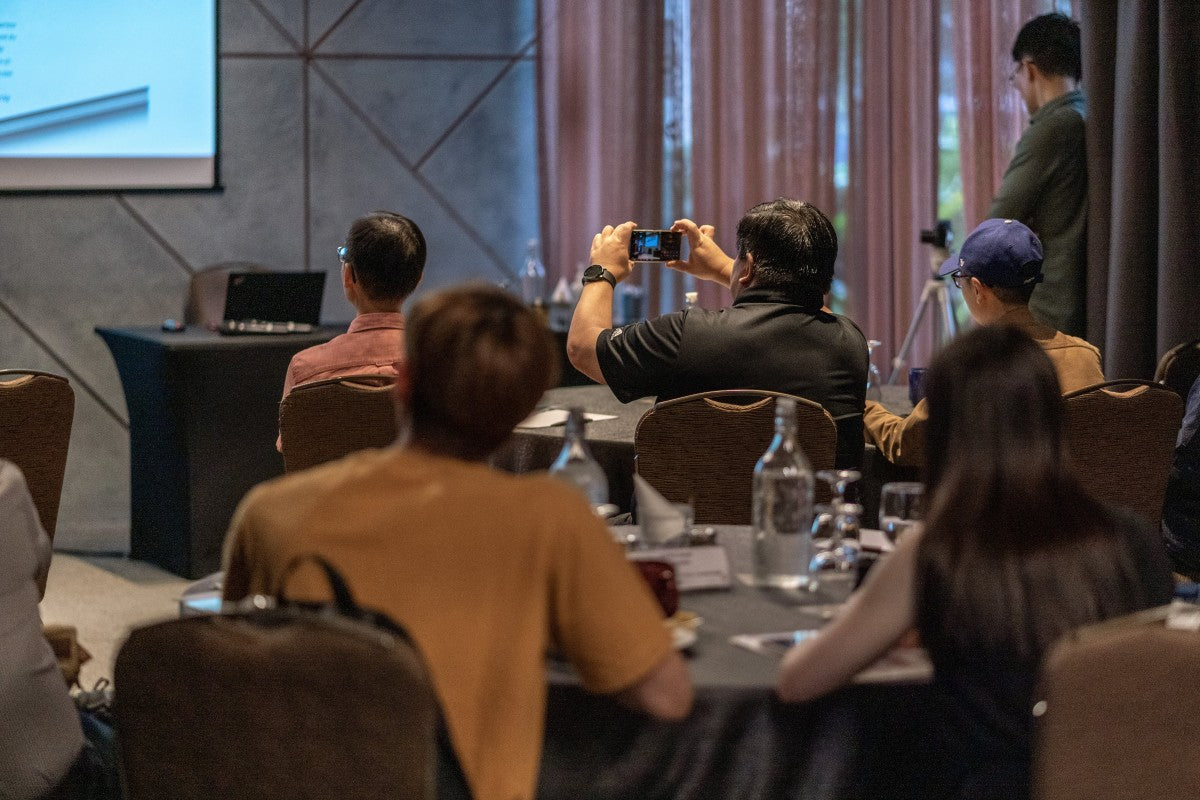 An individual using his smartphone to take photo of the presentation during the Astell&Kern SP3000 and Odyssey media launch event.