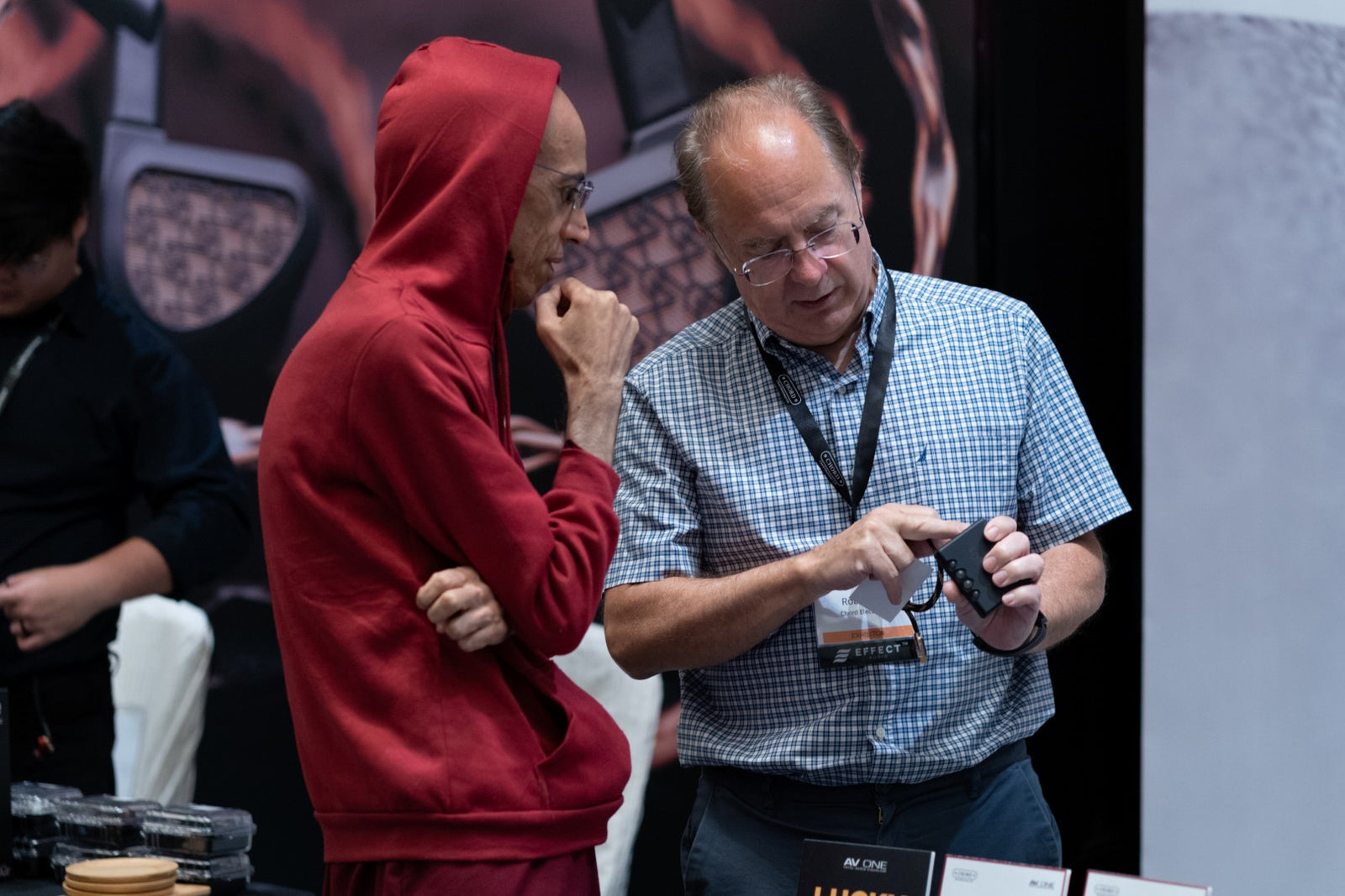 Rob Watts from Chord Electronics and an attendee interacting at CanJam Singapore 2025 event.