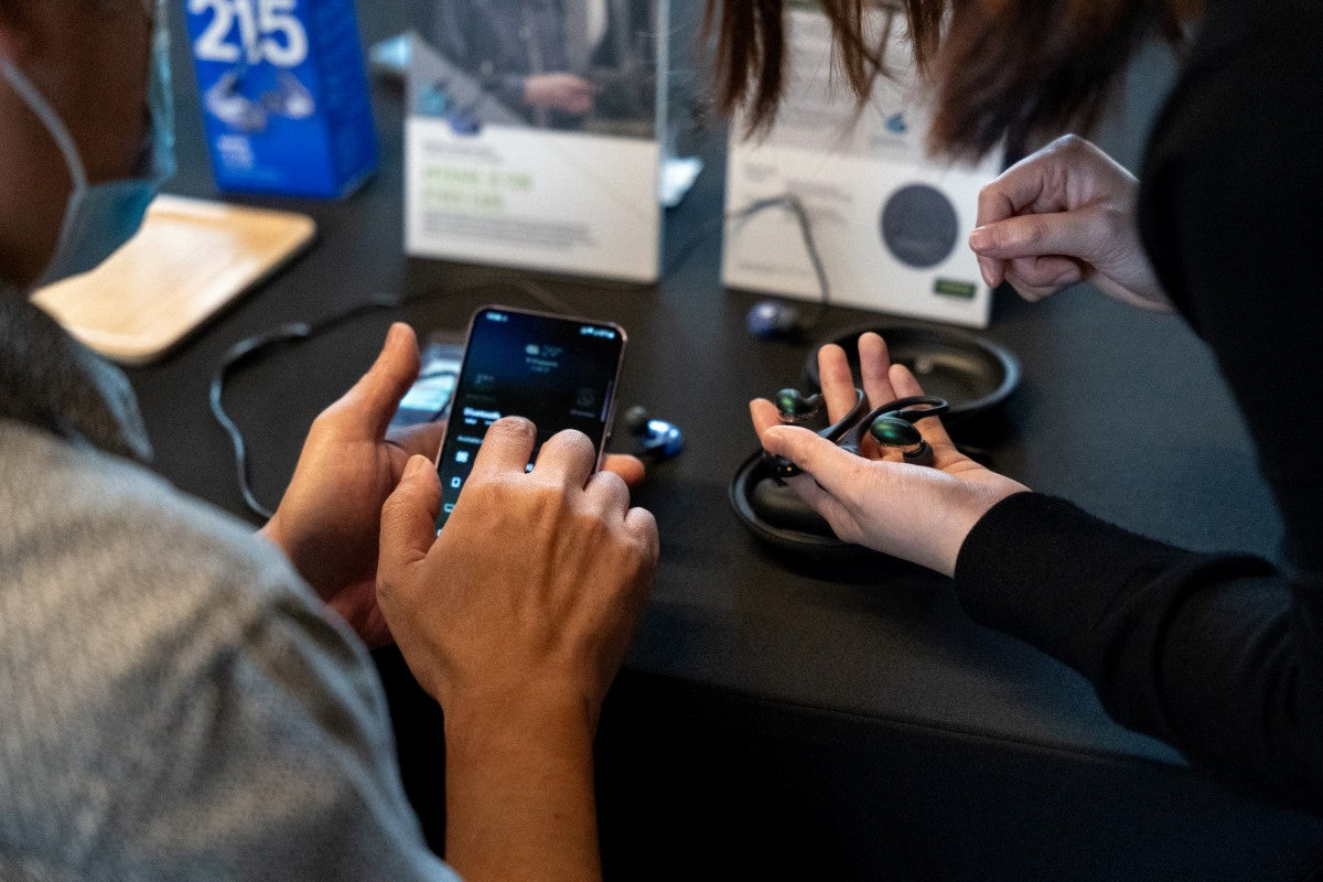 The SE846 Gen 2 in Jade finish, mounted on the RMCE-TW2 True Wireless Adapter, was presented to an attendee at a Shure media event.